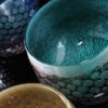 mermaid bowl by allister Malcolm. colourful patterned glass with sterling silver leaf