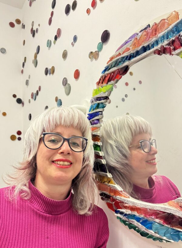 Mirrors and glass murals created using recycled materials.