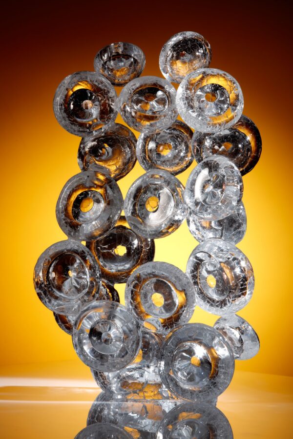 thick glass bubbles joined together to form a beautiful sculpture, each bubble has a crackled surface forming new work by allister Malcolm