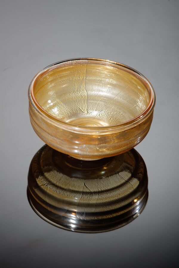 a golden or silvery decorative bowl with a beautiful texture looks like an antique of the future or the perfect gift, for sale on the website