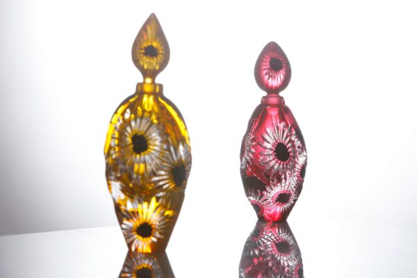 a pair of bottles handblown and hand cut in England by glass artist Allister Malcolm